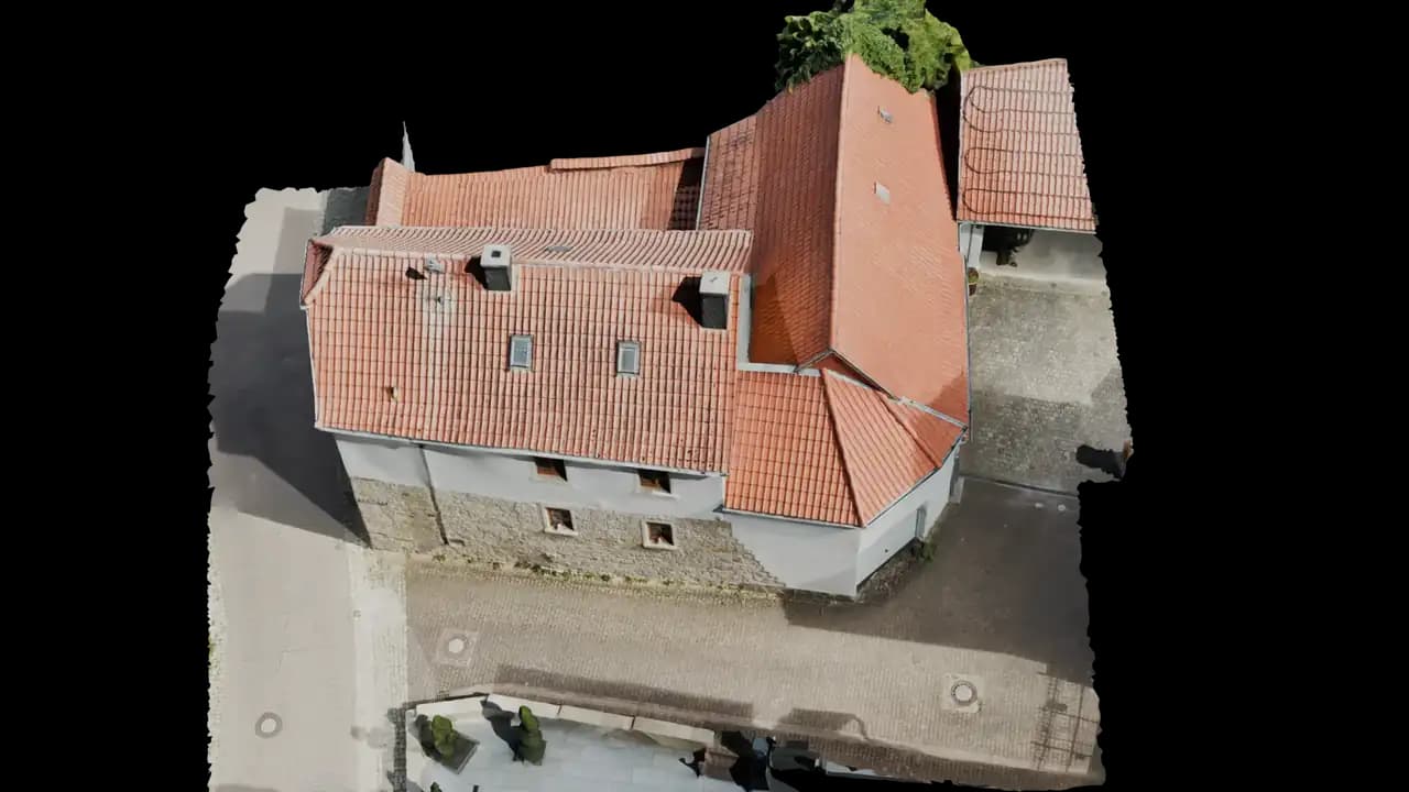 Photogrammetric 3D model of a residential home with barn, tiled roofs and paved courtyard